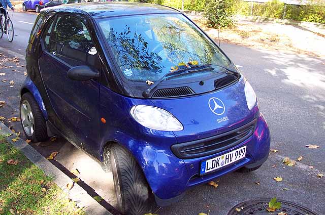 A Mercedes Benz / Smart car.